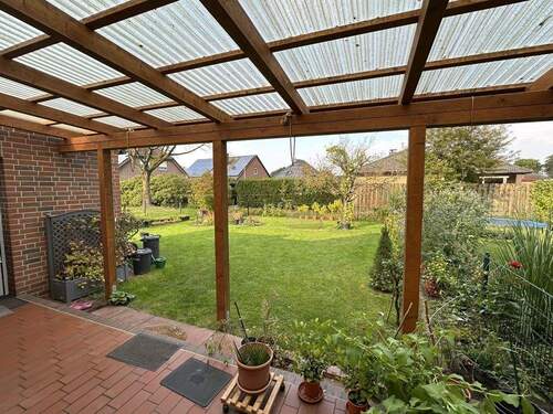Gartensicht von der Terrasse - Doppelhaushälfte mit 90,90 m² in Rhauderfehn / Burlage zum Kaufen