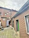 Hausrückseite mit Terrasse - 