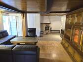 Wohnbereich mit Kaminofen - Einfamilienhaus mit 130,00 m² in Dreieich zum Kaufen