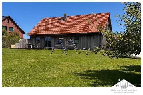 Hausansicht vom Garten aus - Einfamilienhaus mit 100,00 m&sup2; in Grevesmühlen / Hoikendorf zum Kaufen