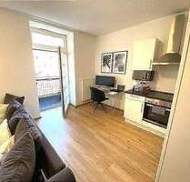 Frei ab sofort 2 - Zimmer-Wohnung im 1. Obergeschoss mit Aufzug Einbauküche Balkon - Bitburg