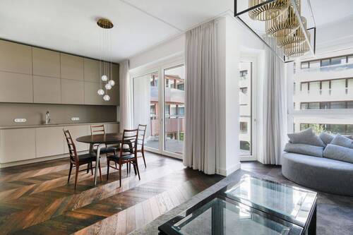 Wohn-und Essbereich offener Küche - AM TACHELES - Elegante 2-Zimmer-Wohnung in Bestlage
