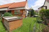 Garten mit Hochbeet - 