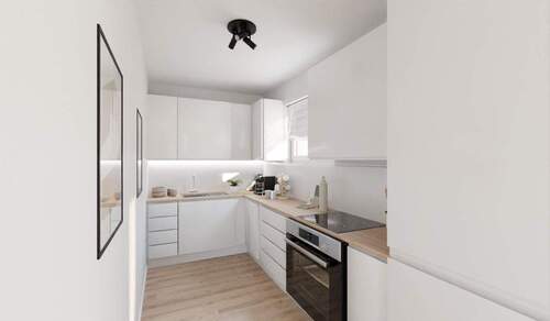 Die offene Wohnküche lädt zu gemeinsamen Mahlzeiten ein - 3 Zimmer Etagenwohnung zum Kaufen in Düsseldorf