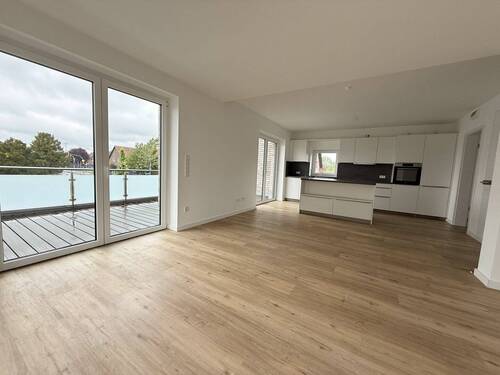 Wohnzimmer mit offener Küche - 3 Zimmer Etagenwohnung in Bissendorf