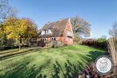 Sonnige Gartenansicht des Hauses - 6 Zimmer Einfamilienhaus zum Kaufen in Lamstedt