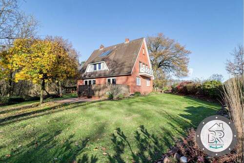 Sonnige Gartenansicht des Hauses - 6 Zimmer Einfamilienhaus zum Kaufen in Lamstedt