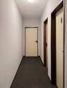 Flur 1. OG WC und Aufenthaltsrsaum.jpg - 