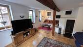 Gemütliches Wohnzimmer mit Kamin - 6 Zimmer Einfamilienhaus zum Kaufen in Reichelsheim / Unter-Ostern