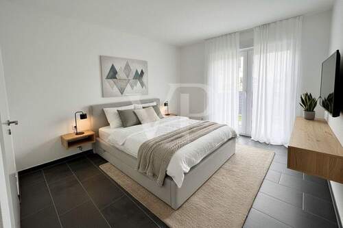 Titelbild - Neuwertige Erdgeschosswohnung mit Terrasse und Tiefgaragenstellplatz