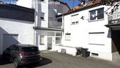 Bild 1 - Wohn- und Geschäftshaus + Garagen + 1.186 m² großes Grundstück zu verkaufen