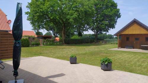 Außenansicht Terrasse und Garten mit Gartenhaus - Einfamilienhaus mit 178,00 m&sup2; in Hagen im Bremischen / Driftsethe zum Kaufen