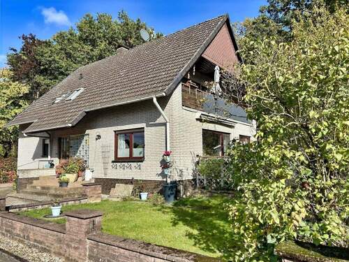 Hausansicht - 6 Zimmer Mehrfamilienhaus, Wohnhaus zum Kaufen in Walsrode