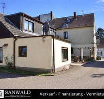 Gepflegtes Mehrfamilienhaus mit Anbau und Bauland inkl. positiver Bauvoranfrage - Bochum Gerthe