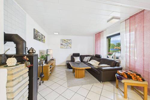 Wohnzimmer - Einfamilienhaus mit 129,60 m² in Neuenhaus zum Kaufen