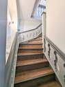 Treppe zum 1.OG vermietete Einheit - 