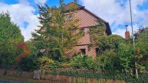 Bild 2 - 8 Zimmer Mehrfamilienhaus, Wohnhaus in Heinade