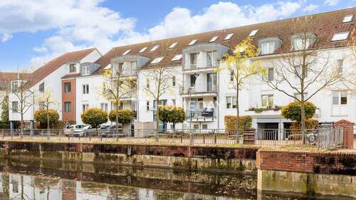 Außenansicht 5 - Leineinsel: Kompaktes Wohnjuwel am Wasser mit Loggia und KFZ-Stellplatz