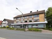 Ansicht Straße - Mehrfamilienhaus, Wohnhaus zum Kaufen in Detmold / Spork-Eichholz