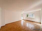 großzügiges Wohnzimmer - ELVIRA - Unterhaching, attraktive 3-Zimmer-Wohnung mit sonnigem Balkon