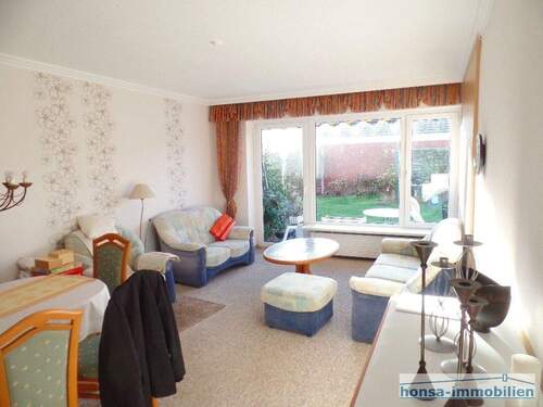 Wohnzimmer mit Zugang zur Terrasse - 