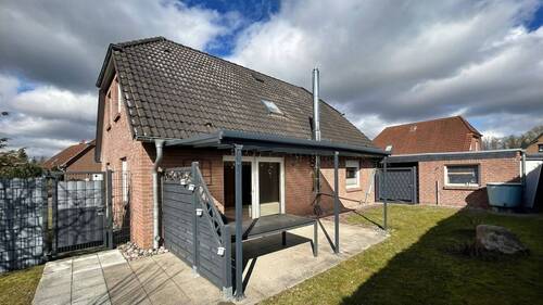 Hinteransicht mit Terrasse - Einfamilienhaus mit 133,30 m&sup2; in Lübow zum Kaufen