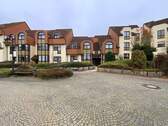 Mehrstöckige Wohngebäude im Käthe-Kollwitz-Weg mit Vorplatz - 3-Zimmer-Wohnung im Erdgeschoss (Hochparterre)