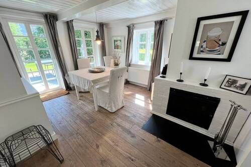 Wohnen / Essen mit Kamin und Terrassenzugang - Mehrfamilienhaus, Wohnhaus mit 125,00 m² in Oevenum zum Kaufen