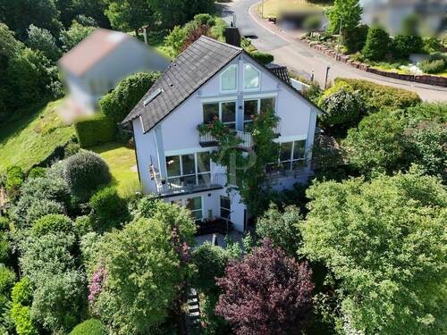 Haus und Gartenansicht - Einfamilienhaus mit 204,00 m&sup2; in Wertheim / Hofgarten zum Kaufen