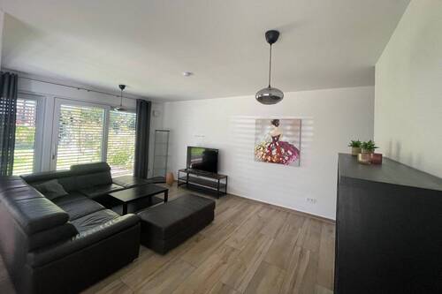 Wohnbereich mit Zugang zur Westterrasse - Einfamilienhaus mit 110,00 m&sup2; in Dießen zum Kaufen