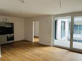 Wohnbereich mit Küche - Moderne 2-Zimmer-Neubauwohnung mit Balkon!