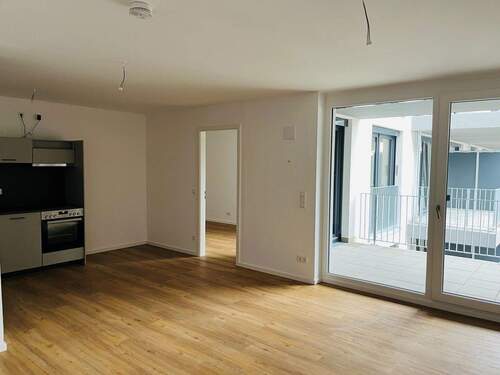 Wohnbereich mit Küche - Moderne 2-Zimmer-Neubauwohnung mit Balkon!
