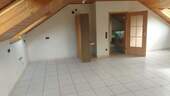 Wohnzimmer - Großzügige 2-Zimmer Dachgeschosswohnung im Grünen