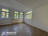 Wohnzimmer mit offener Küche - 