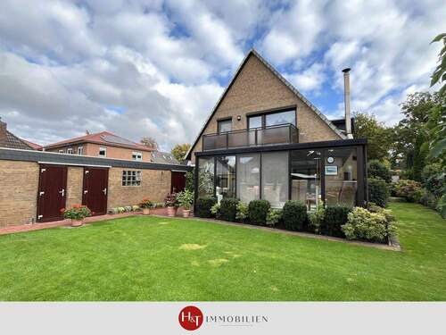 Kauf Wohnhaus Stuhr - H&T Immobilien - Wohnhaus mit Wintergarten und Gartenidylle in Stuhr!