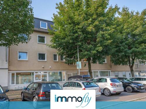 Hausansicht - Helle 4-Zimmer-Eigentumswohnung mit Garten, Tageslichtbad und flexible Raumgestaltung