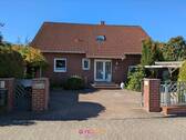Außenansicht - Kralenriede: Gepflegtes Einfamilienhaus mit Einliegerwohnung - günstig durch Erbpacht