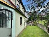 Teilansicht Garten - Einfamilienhaus mit 140,00 m² in Steinbach-Hallenberg zum Kaufen
