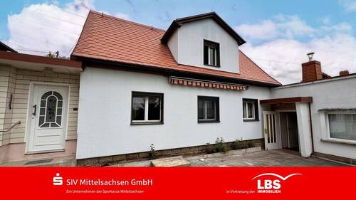 Ansicht mit Terrasse - Wohnen mit Blick ins Grüne - 125.000,00 EUR Kaufpreis, ca.  77,00 m² Wohnfläche