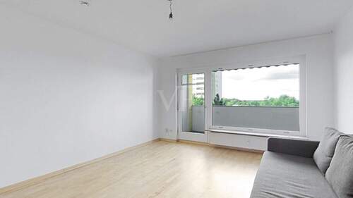 Wohnzimmer mit Blick zum Balkon - 