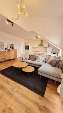 Bild 1 - Erstbezug nach Sanierung - Exklusive, vollmöblierte Dachgeschosswohnung mit Dachterrasse & TG