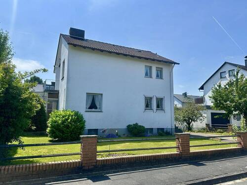 Außenansicht (Straßenseite) - Einfamilienhaus mit Garten & Platz für Ihre Ideen in Lage-Müssen!