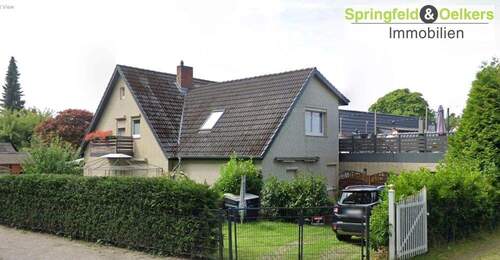 Straßenansicht - Charmantes Einfamilienhaus mit vielseitigen Nutzungsmöglichkeiten