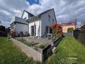 Hausansicht Terrasse - Eigentumswohnung im Erdgeschoss 