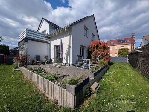 Hausansicht Terrasse - Eigentumswohnung im Erdgeschoss 