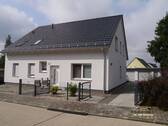 Hausansicht - Etagenwohnung mit 100,50 m&sup2; in Holzweißig zum Kaufen