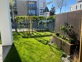 Herzo_Garten.jpg - Terrasse und Garten in Ihrer neuen großzügigen 4-Zimmer Wohnung