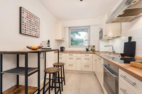 Moderne Einbauküche - Etagenwohnung mit 118,00 m&sup2; in München zum Kaufen