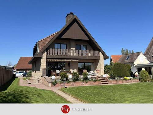 Verkauf Ein - Zweifamilienhaus Syke Heiligenfelde - H&T Immobilien - Feldrandlage! Großzügiges EFH mit Einliegerwohnung und Traumgarten