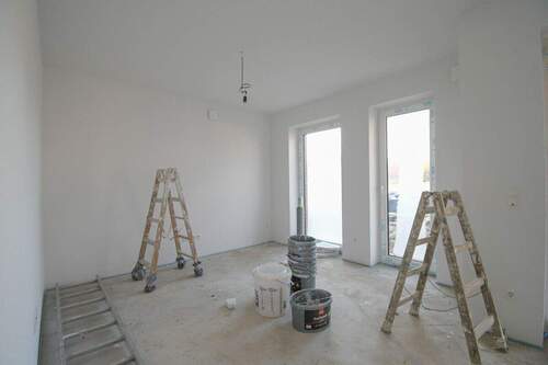 Wohnzimmer mit offener Küche - Etagenwohnung mit 77,20 m² in Edewecht zur Miete